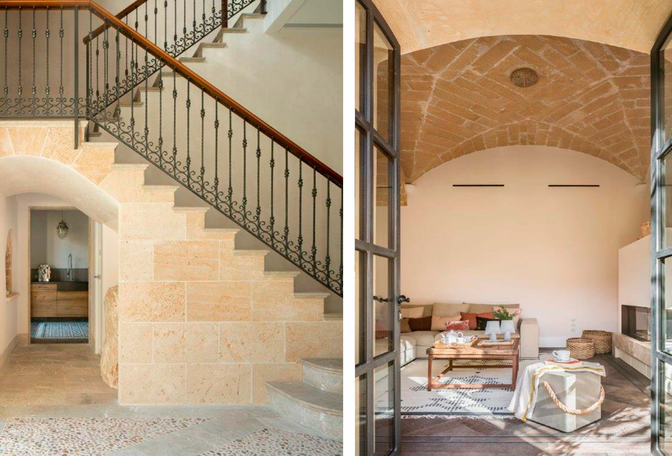 Escalera de piedra con barandilla de forja y salón con bóveda de piedra tras puertas acristaladas