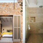 Schlafzimmer mit gelber Decke, zwischen geöffneten grauen Fensterläden zu sehen, und Dusche in Beige mit Glastrennwand