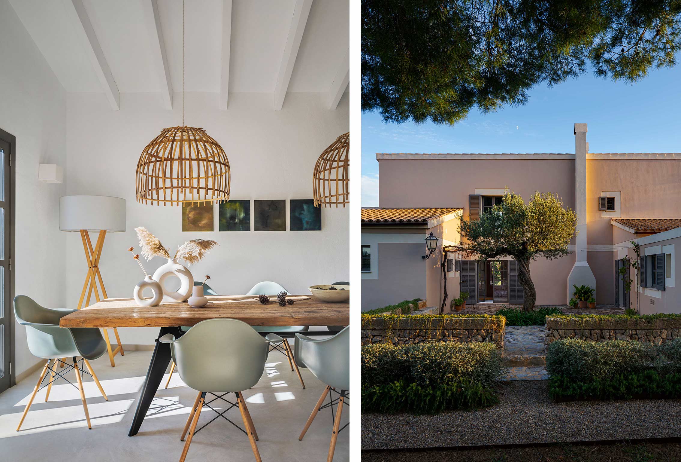 Dining area with wooden table, sage-green chairs and wicker lamps, beside a pink façade with an olive tree