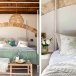 Dormitorio con cama de cuatro postes, arco de piedra, manta verde y lámpara de mimbre