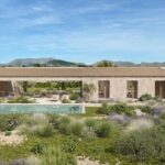 Render of Can Gat with a stone facade, a long pool and mountains beyond