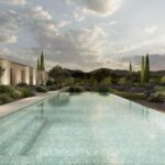 Render of the long pool at sunset, with cypresses, lavender and the illuminated stone facade