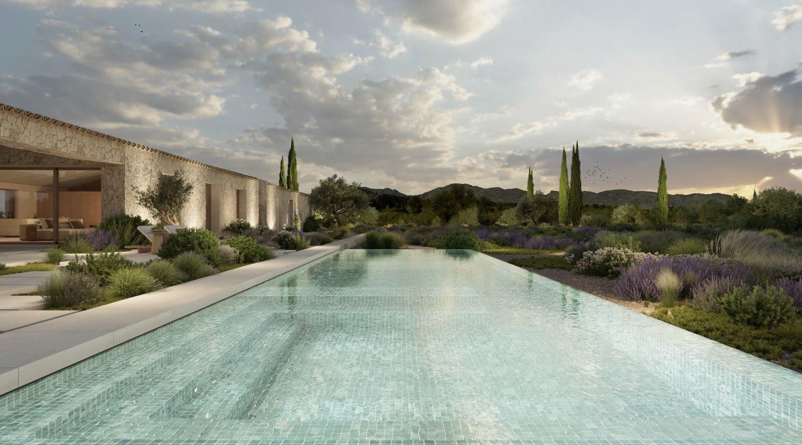 Render of the long pool at sunset, with cypresses, lavender and the illuminated stone facade