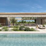 Render of the Can Gat swimming pool in front of the open porch, with sun loungers and Mediterranean planting