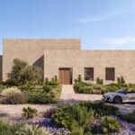 Render de la fachada de acceso de Can Melis con puerta de madera y jardín mediterráneo